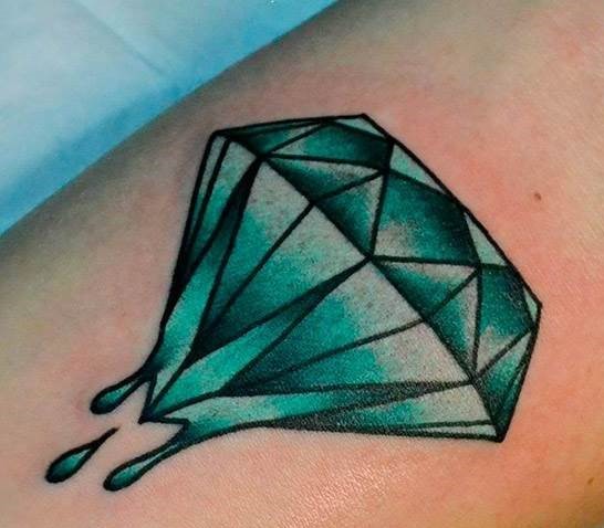 Colored diamond tattoo on leg for women