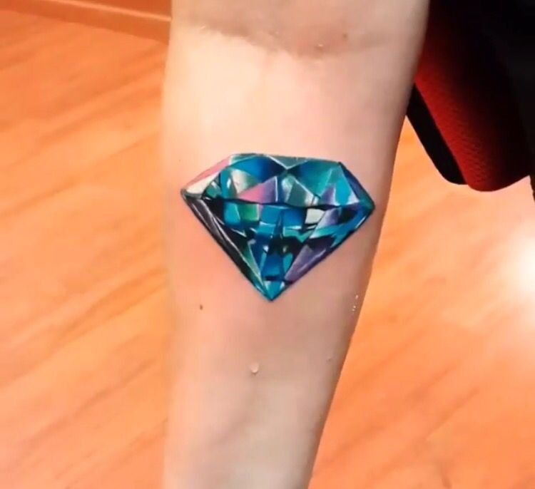 Colorful diamond tattoo on forearm for women