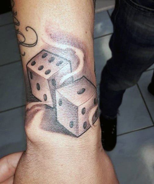 Dice tattoo on forearm for men