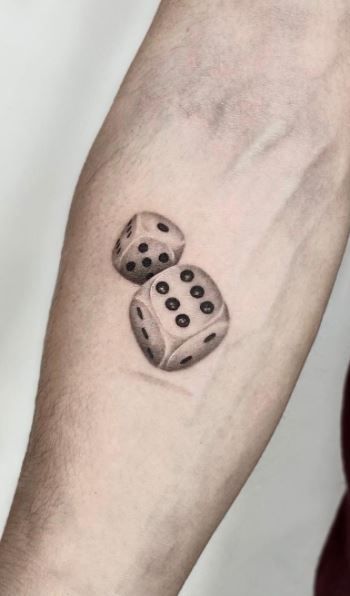 Dice tattoo on forearm for men