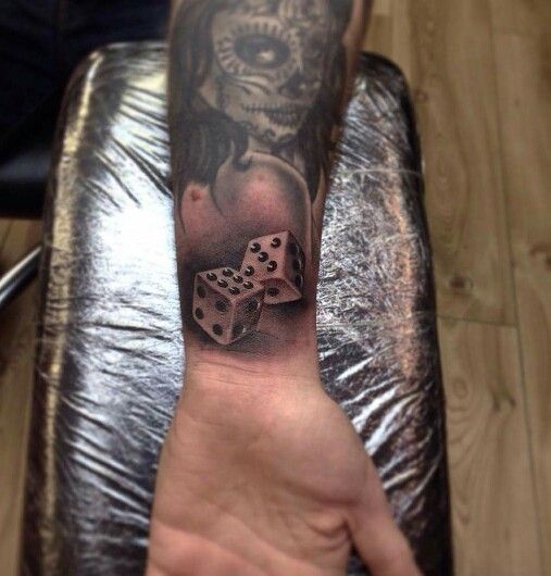 Dice tattoo on forearm for men