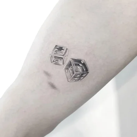 Dice tattoo on the arm for men