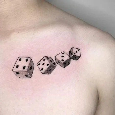 Dice tattoo on collarbone for men