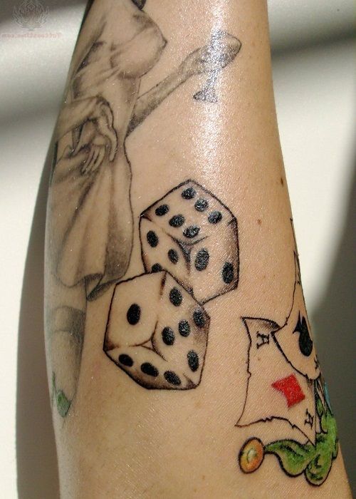 Dice tattoo on arm for women