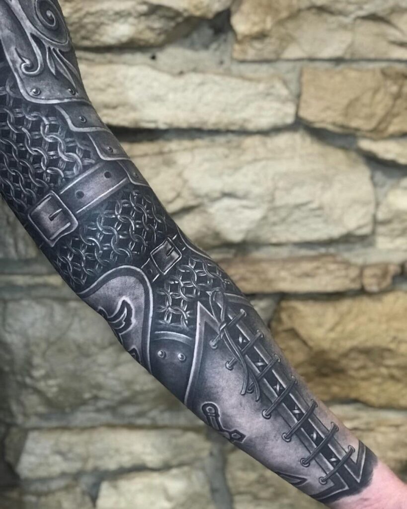 Large armor tattoo on the arm for men