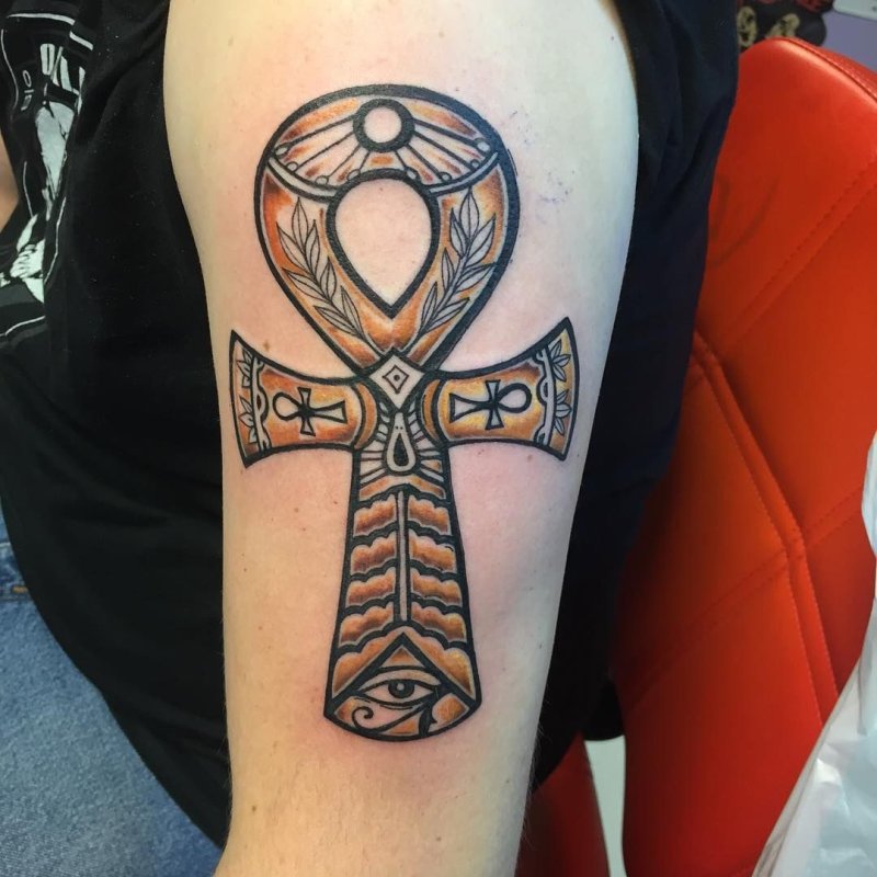 Large ankh tattoo on the shoulder for men