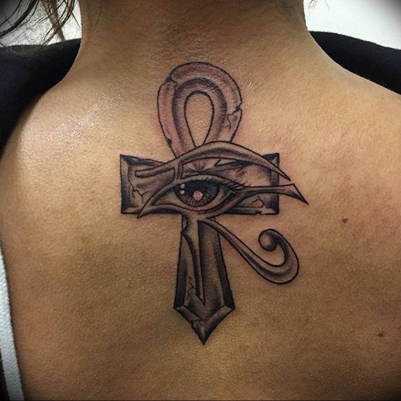 Ankh tattoo on the back for women