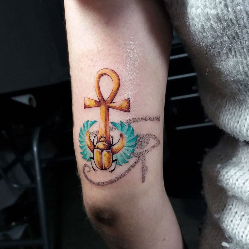 Colorful ankh tattoo on shoulder for women