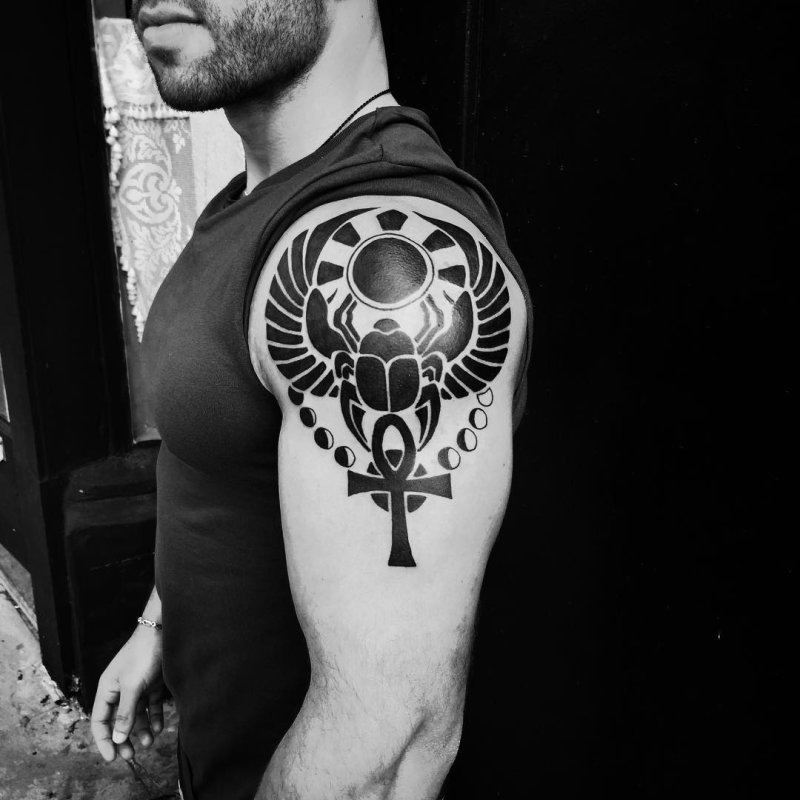 Ankh tattoo on the shoulder for men