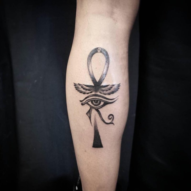 Ankh tattoo on the calf for men