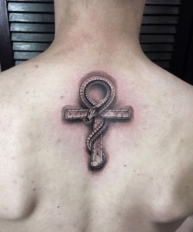 Ankh tattoo on the back for men