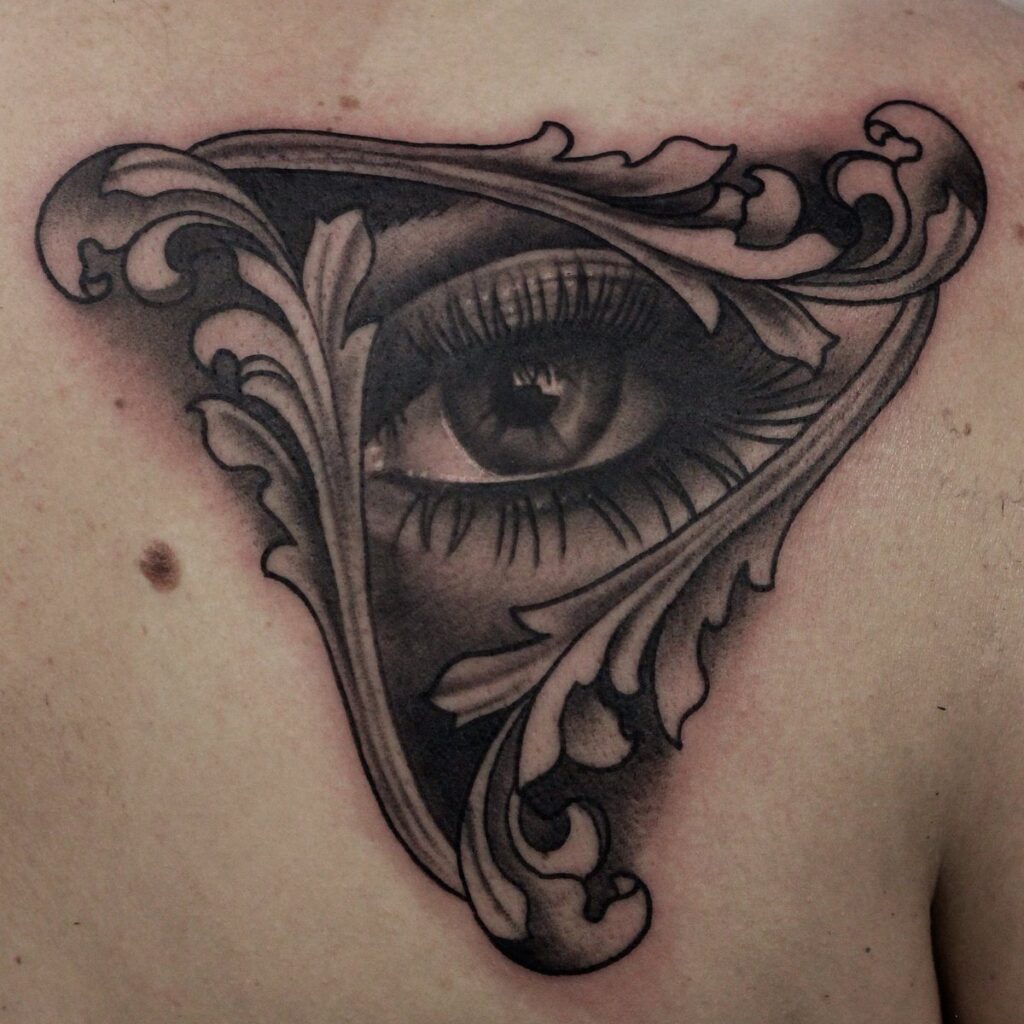 Eye tattoo on chest for women