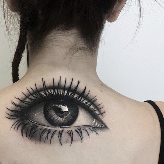 Eye tattoo on back for women