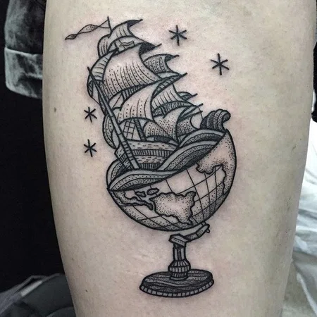 Globe tattoo on leg for men