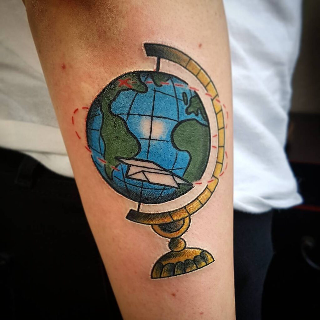 Globe tattoo on arm for men