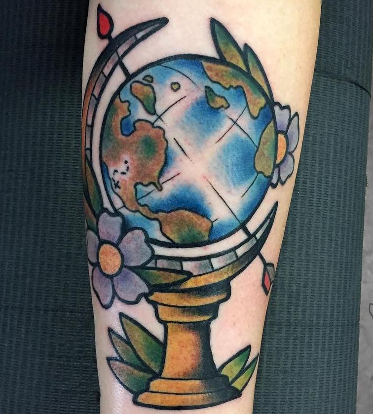 Large globe tattoo on leg for men