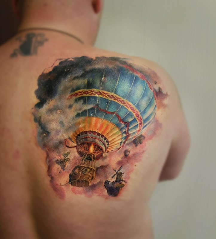 Balloon tattoo on the shoulder blade for men