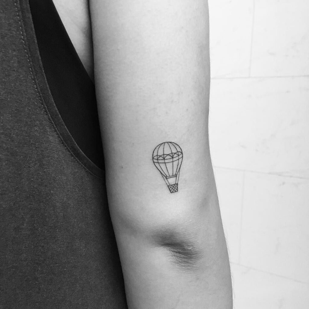 Balloon tattoo on shoulder for women