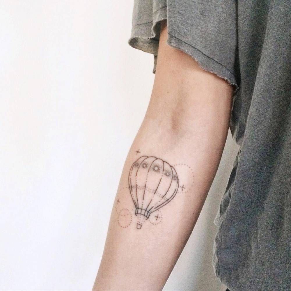 Balloon tattoo on forearm for women