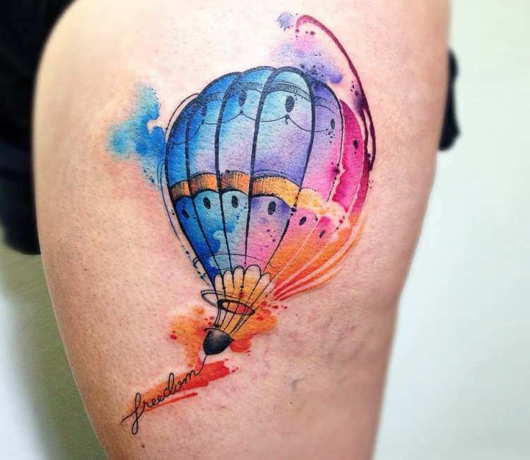 Colorful balloon tattoo on thigh for women