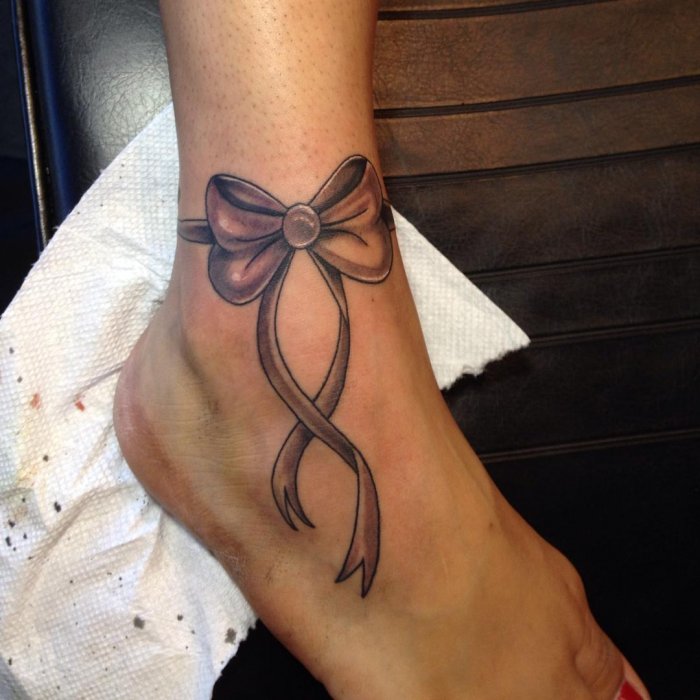 Ankle bow tattoo for women