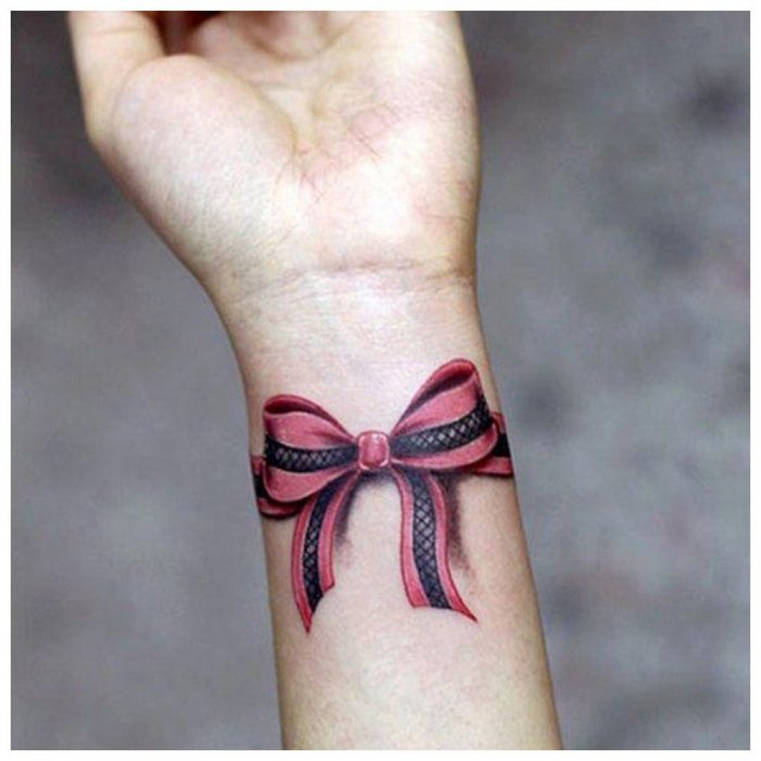 Colorful bow tattoo on wrist for women