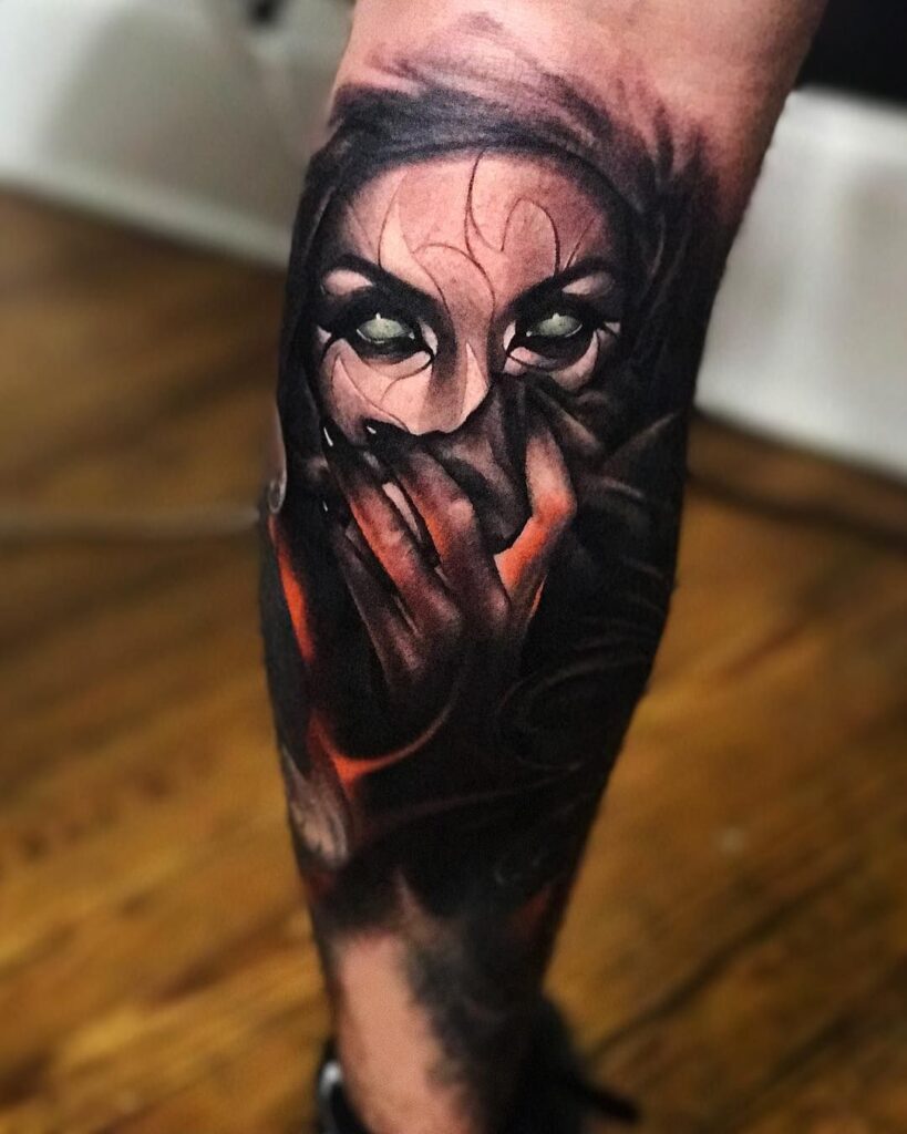 Horror style tattoo on the calf for men