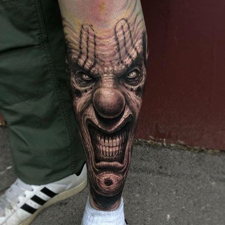 Horror style tattoo on the shin for men