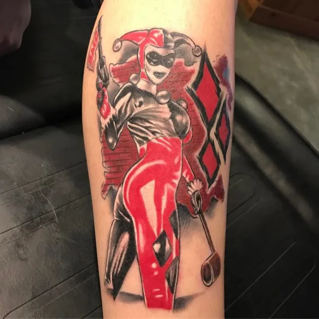 Harlequin tattoo on shin for men