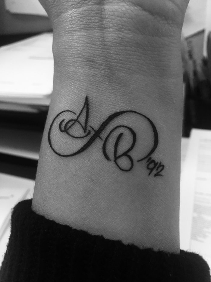 Infinity tattoo on forearm for women