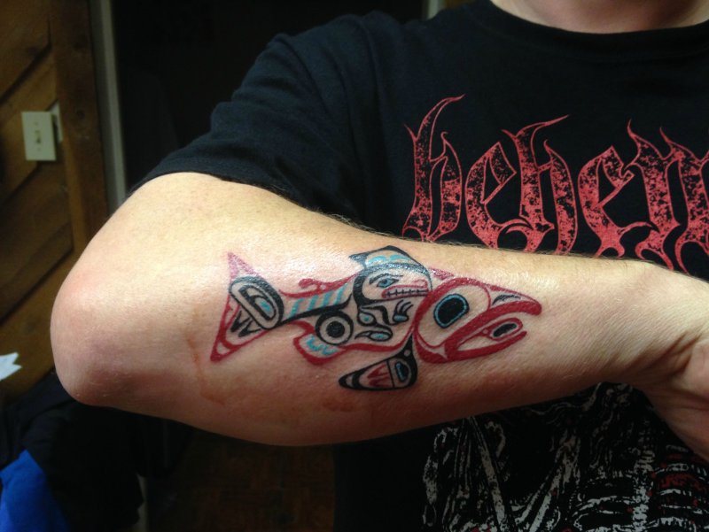 Hyde style tattoo on forearm for men