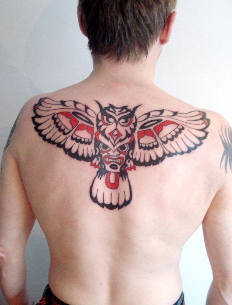 Hyde style tattoo on the back for men