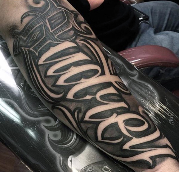 Lettering style tattoo on the forearm for men