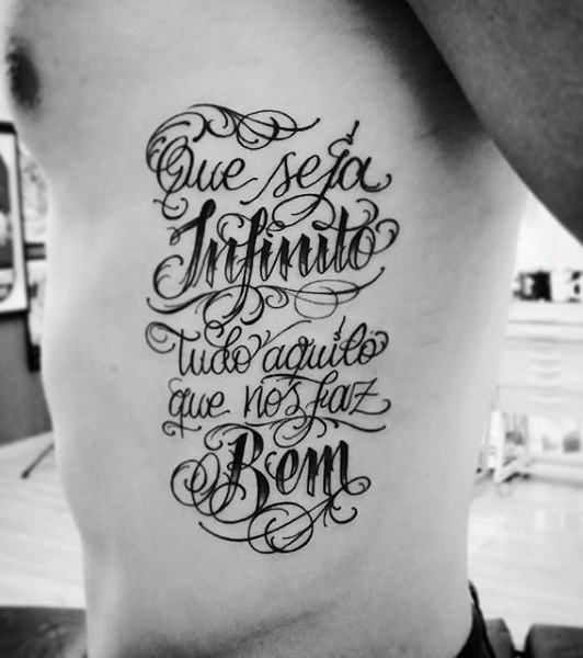 Lettering style tattoo on the side for men