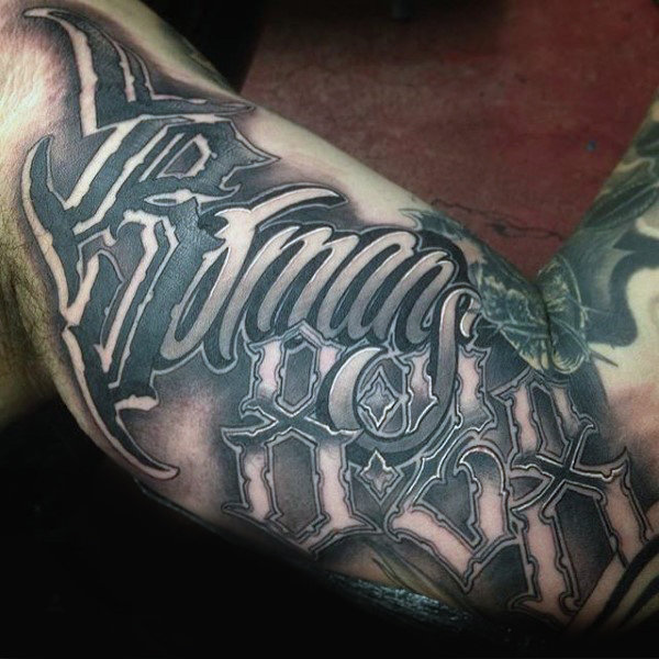 Lettering style tattoo on the arm for men