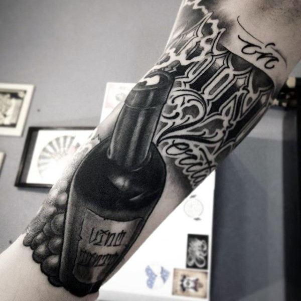 Lettering style tattoo on the arm for men