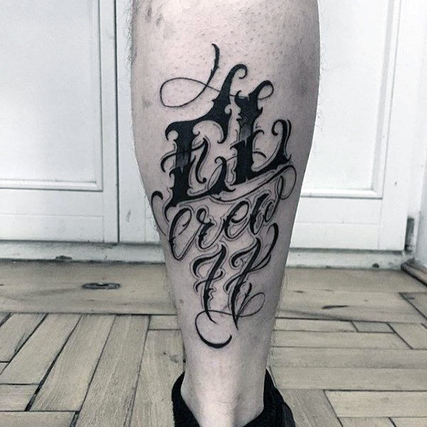 Lettering style tattoo on calves for men