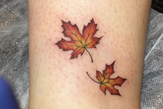 Maple leaf tattoo on arm for women Maple leaf tattoo on arm for women