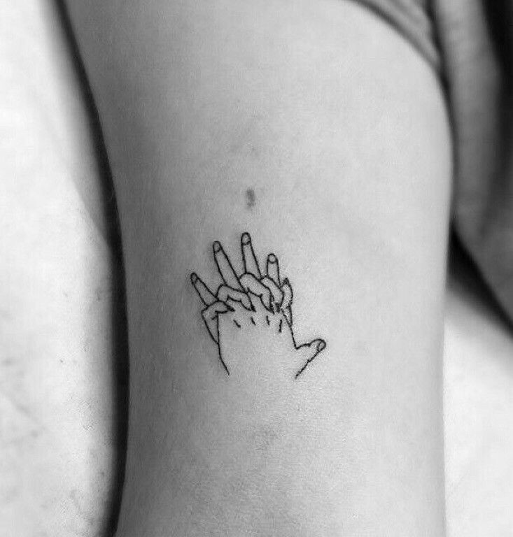 Minimalist tattoo on the arm for women