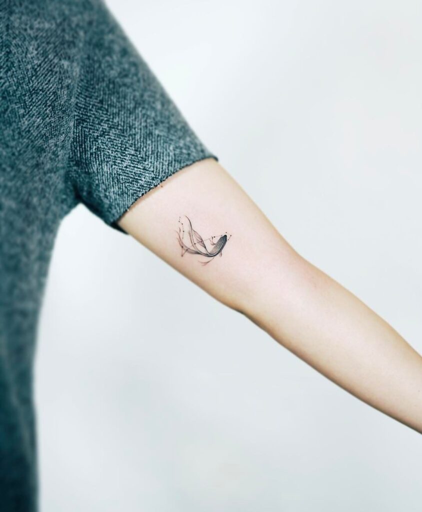 Minimalist fish zodiac sign tattoo on the shoulder for women