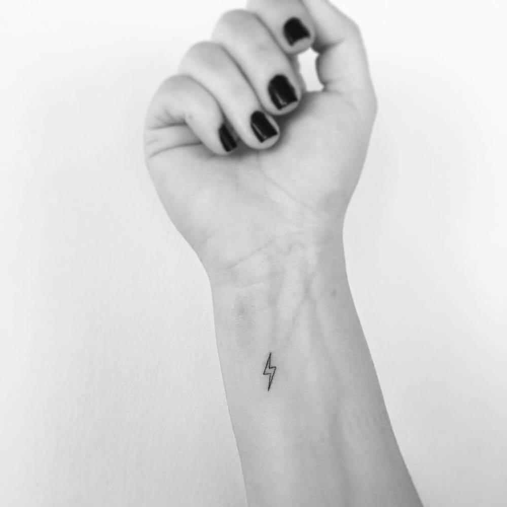 Minimalist tattoo on the wrist for women