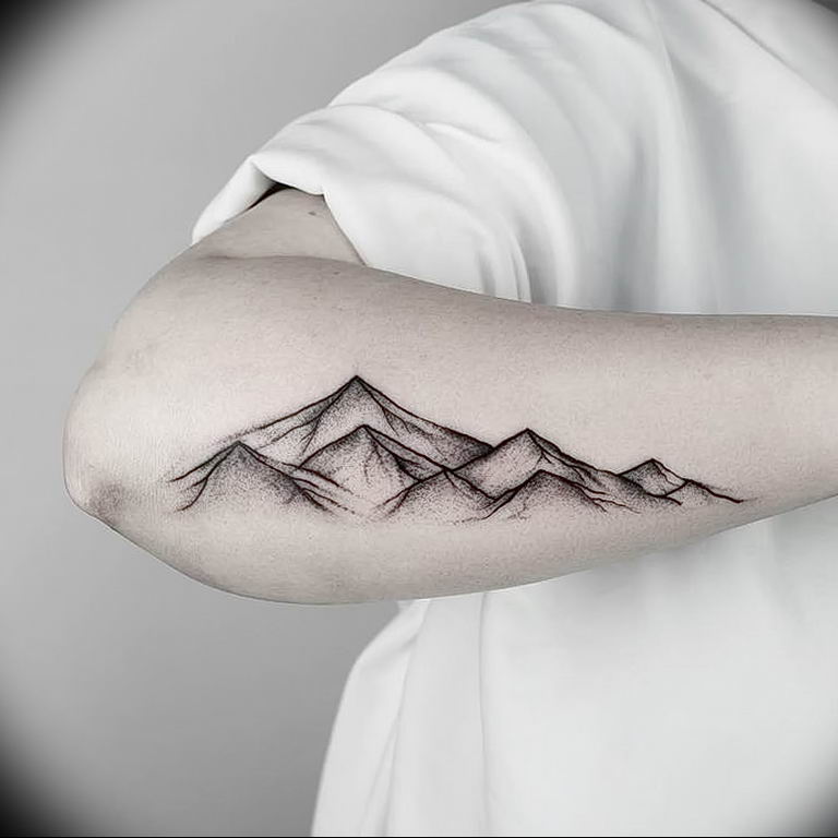 Mountain tattoo on forearm for men