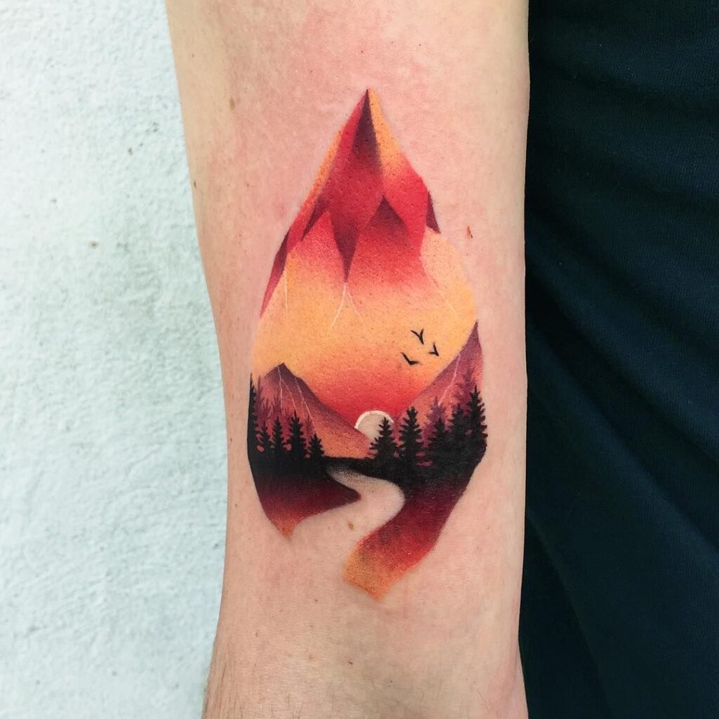 Colorful mountain tattoo on shoulder for men