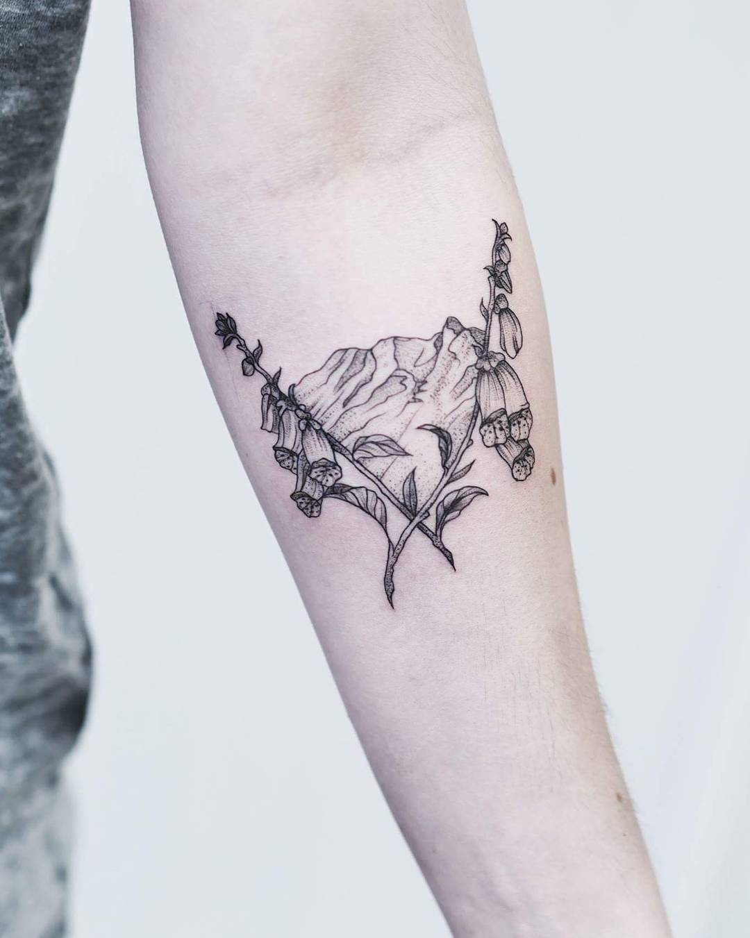 Mountain tattoo on forearm for men