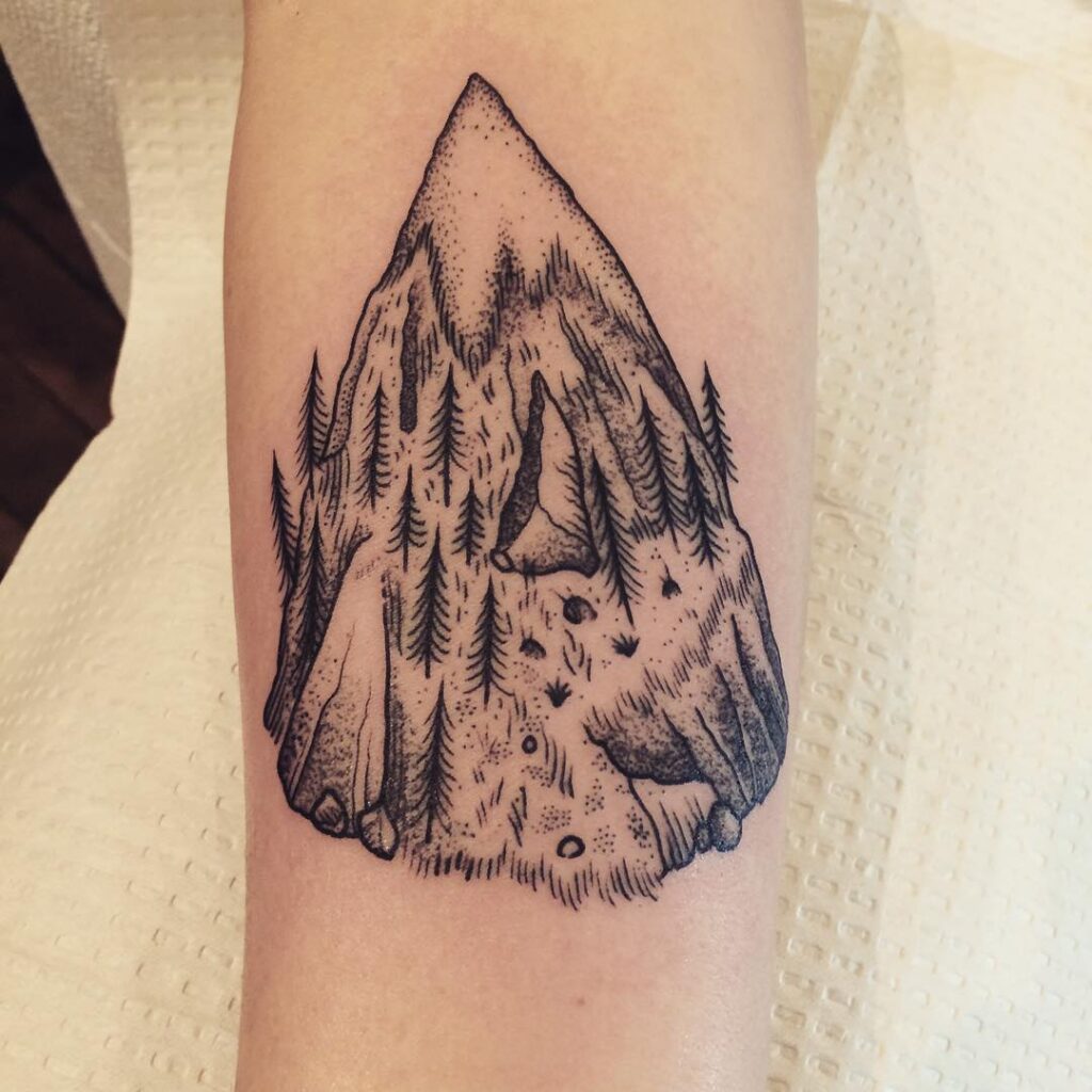 Mountain tattoo on forearm for women