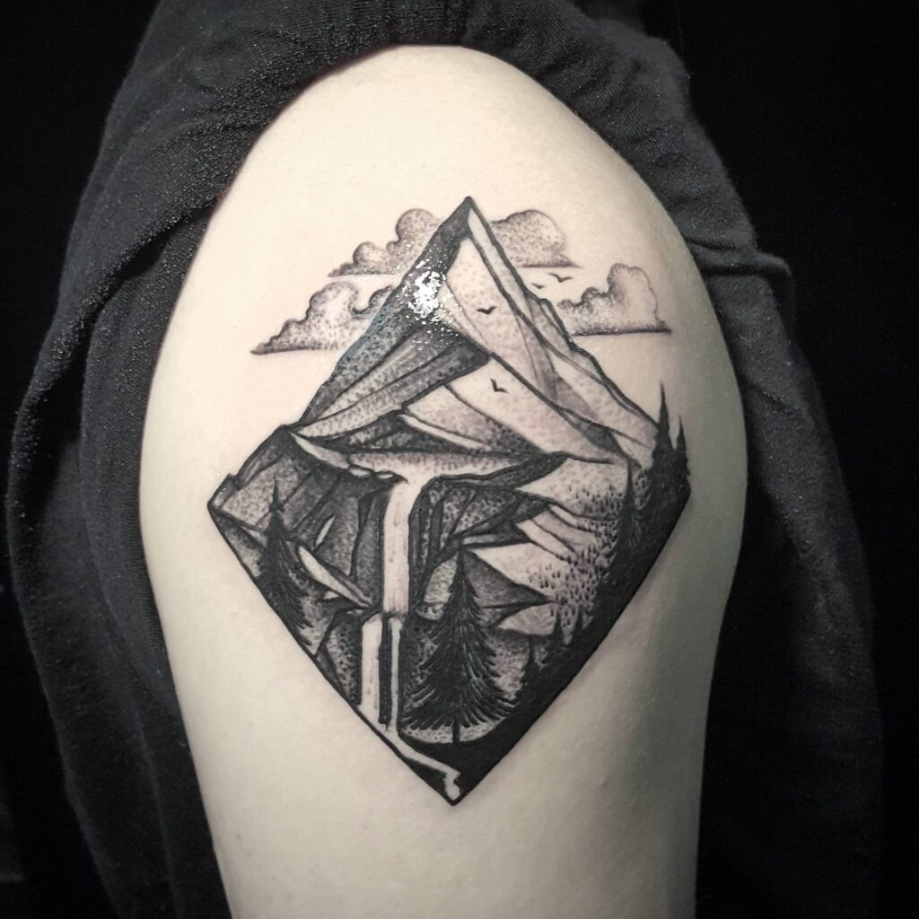 Mountain tattoo on the shoulder for men