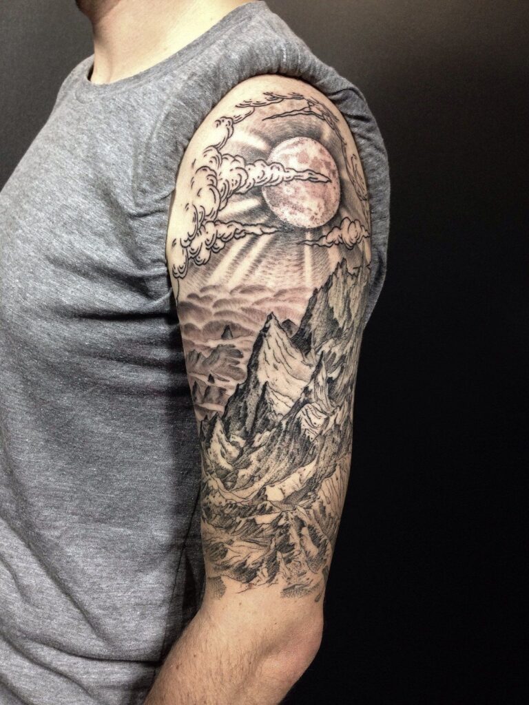 Mountain tattoo on the shoulder for men