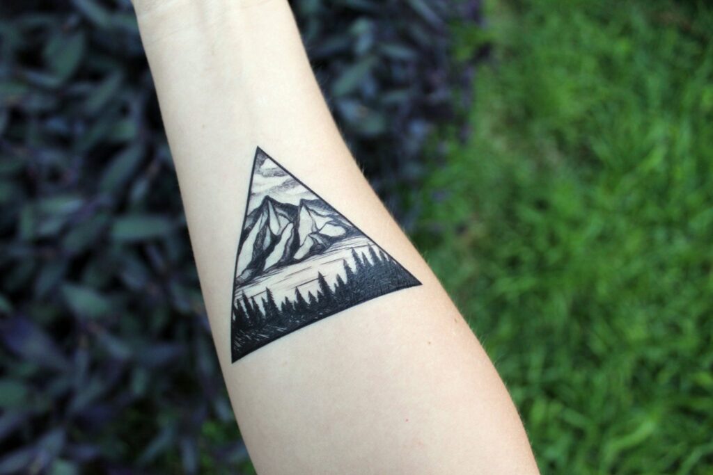 Mountain tattoo on arm for men