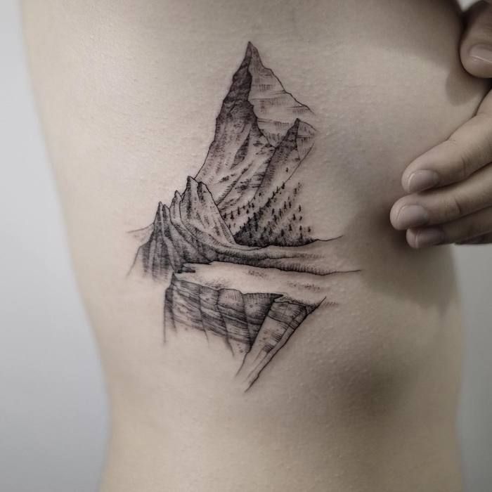 Mountain tattoo on the side for women