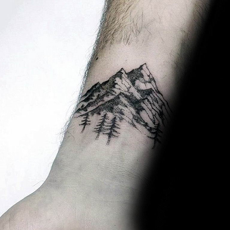 Mountain tattoo on wrist for men